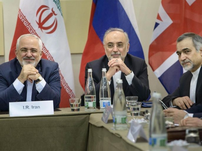 Iranian Foreign Minister Javad Zarif, left, Head of Iranian Atomic Energy Organization Ali Akbar Salehi, second left, Special Assistant to Iranian president Hossein Fereydoun, second right, and Iranian Deputy Foreign Minister Abbas Araghchi wait for the start of a meeting with Britain, Russia, China, France, Germany, European Union and the U.S. officials at the Beau Rivage Palace Hotel in Lausanne, Switzerland Monday, March 30, 2015, during Iran nuclear talks. Negotiations over Iran's nuclear program are entering a critical phase with differences still remaining just two days before a deadline for the outline of an agreement. (AP Photo/Brendan Smialowski, Pool)