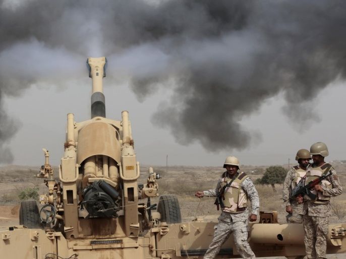 FILE - In this Monday, April 20, 2015 file photo, Saudi soldiers fire artillery toward three armed vehicles approaching the Saudi border with Yemen in Jazan, Saudi Arabia. (AP Photo/Hasan Jamali, File)
