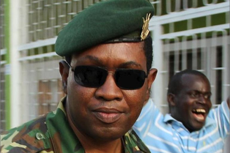 Major General Godefroid Niyombare (C) arrives at the Radio Publique Africaine (RPA) broadcasting studios to address the nation in Burundi's capital Bujumbura, May 13, 2015. The Burundian general said on Wednesday he had deposed President Pierre Nkurunziza for seeking an unconstitutional third term in office and was forming a transitional government, after more than two weeks of protests against the election bid. But as cheering crowds streamed onto the streets of Bujumbura, sporadic gunfire was heard in the centre of the capital, and it was not immediately clear how much support Niyombare had. REUTERS/Jean Pierre Aime Harerimana