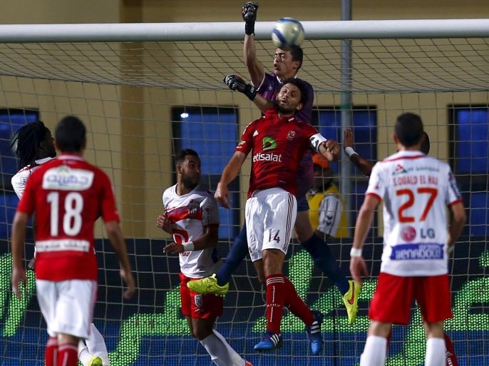 Mohamed El Yousfi (C) goalkeeper of Morocco's Moghreb Tetouan fights for the ball with Hossam Ghaly of Egypt's Al-Ahly during their CAF Champions League soccer match at Petro Sport stadium in Cairo, May 2, 2015. REUTERS/Amr Abdallah Dalsh