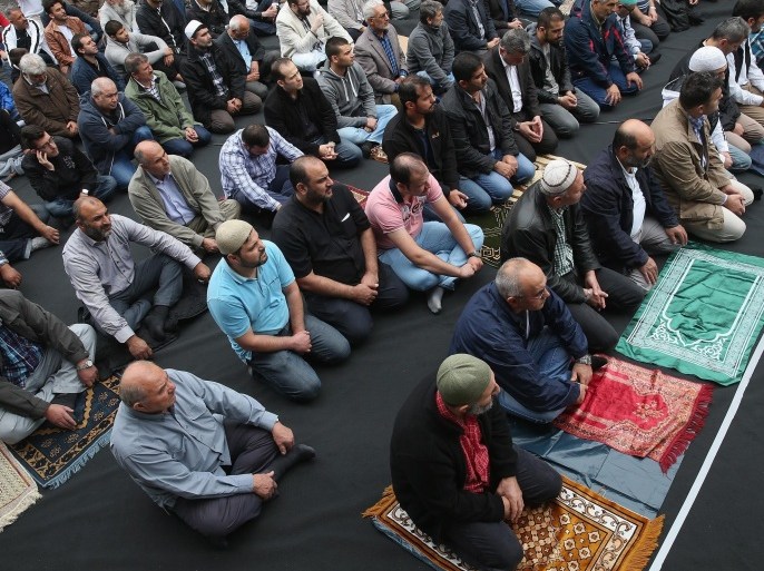BERLIN, GERMANY - SEPTEMBER 19: Muslims gather for Friday prayers on the street outside the Mevlana Moschee mosque on a nation-wide action day to protest against the Islamic State (IS) on September 19, 2014 in Berlin, Germany. Muslims across cities in Germany followed a call by the country's Central Council of Muslims to protest against the ongoing violence by IS fighters in Syria and Iraq.