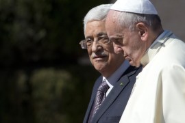 FILE - In this Sunday, May 25, 2014 file photo Pope Francis is welcomed by Palestinian President Mahmoud Abbas upon his arrival to the West Bank city of Bethlehem. The Vatican officially recognized the state of Palestine in a new treaty finalized Wednesday, May 13, 2015 immediately sparking Israeli ire and accusations that the move hurt peace prospects. The treaty, which concerns the activities of the Catholic Church in Palestinian territory, makes clear that the Holy See has switched its diplomatic recognition from the Palestine Liberation Organization to the state of Palestine. (AP Photo/Andrew Medichini, Pool)