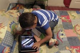 In this Friday, Oct. 21, 2011 photo, Frankie Thevenot, 3, plays with an iPad in his bedroom at his home in Metairie, La. About 40 percent of 2- to 4-year-olds (and 10 percent of kids younger than that) have used a smartphone, tablet or video iPod, according to a new study by the nonprofit group Common Sense Media.