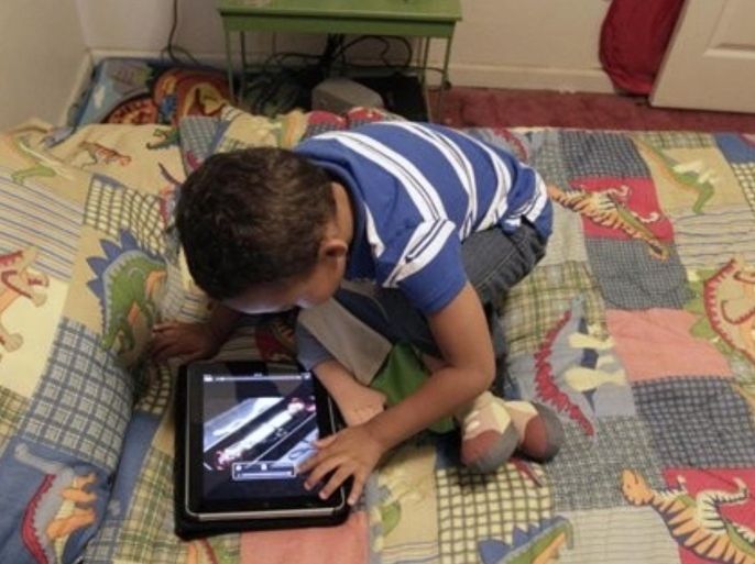 In this Friday, Oct. 21, 2011 photo, Frankie Thevenot, 3, plays with an iPad in his bedroom at his home in Metairie, La. About 40 percent of 2- to 4-year-olds (and 10 percent of kids younger than that) have used a smartphone, tablet or video iPod, according to a new study by the nonprofit group Common Sense Media.