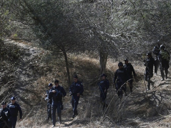 Mexican federal police patrol Arteaga town in Michoacan State, Mexico, on March 2, 2015. Mexican police captured Knights Templar drug cartel's leader Servando Gomez, aka 'La Tuta' on February 27 in Morelia, Michoacan, taking down one of the country's most wanted fugitives whose gang tormented the western state of Michoacan. AFP PHOTO/ALFREDO ESTRELLA