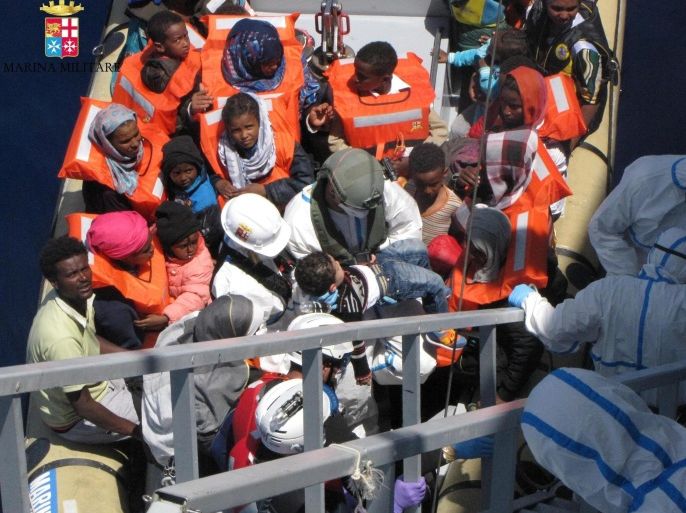 A handout image provided by the Italian Navy on 04 May 2015 shows migrants being taken off a small boat during rescue operations in the Mediterranean Sea, 03 May 2015. At least 10 migrants died off Libya as they tried to cross the Mediterranean, the Italian coastguard said on 03 May, amid news that more than 4,200 migrants were rescued by European ships in several operations. EPA/MARINA MILITARE / HANDOUT