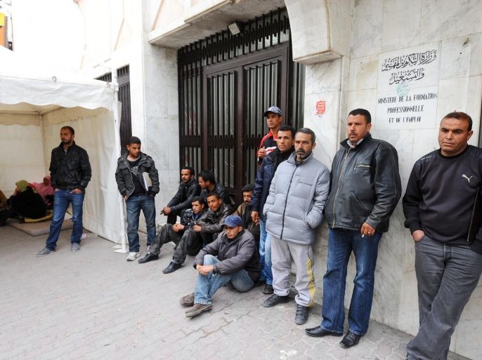 Unemployed people and miners of Oum Larayes block the access to the Labour Ministry headquarters in Tunis on April 20, 2012, to protest against the results of a recruitment exam organized by the Phosphate Gafsa Company (CPG), the main employer in the region hit by unemployment. The phosphate mines of Gafsa, in central-western Tunisia, are paralyzed by civil demonstrations for employment, which block the access to the mines.