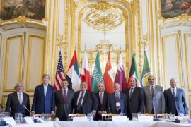 In this May 8, 2015, photo, Secretary of State John Kerry and Foreign Ministers of the Gulf Cooperation Council pose for photographers at the Chief of Mission Residence in Paris, France, to discuss Middle East concerns about an emerging nuclear deal with Iran. Kerry has also visited Sri Lanka, Somalia, Djibouti, Kenya, and Saudi Arabia on his trip. Many Americans like the idea of the preliminary deal that would limit Iran’s nuclear program but very few people really believe Tehran will follow through with the agreement. (AP Photo/Andrew Harnik, Pool)