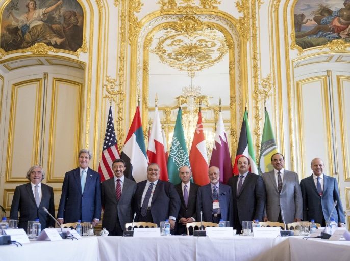 In this May 8, 2015, photo, Secretary of State John Kerry and Foreign Ministers of the Gulf Cooperation Council pose for photographers at the Chief of Mission Residence in Paris, France, to discuss Middle East concerns about an emerging nuclear deal with Iran. Kerry has also visited Sri Lanka, Somalia, Djibouti, Kenya, and Saudi Arabia on his trip. Many Americans like the idea of the preliminary deal that would limit Iran’s nuclear program but very few people really believe Tehran will follow through with the agreement. (AP Photo/Andrew Harnik, Pool)