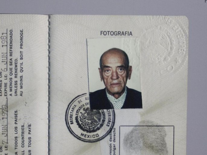 In this Aug. 1, 2013 photo, the passport of Spanish filmmaker Luis Bunuel hangs at an exhibit inside the "Casa Bunuel" in Mexico City. The plan is to turn the building into a meeting place for Spanish and Mexican moviemakers, with workshops and occasional exhibits staged to celebrate Spanish-language cinema. (AP Photo/Gabriela Sanchez)