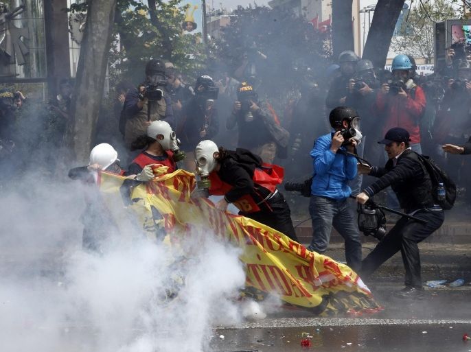 Turkish protestors clash with riot police as police use water cannon and tear gas to disperse protestors during a May Day rally in Istanbul, Turkey, 01 May 2015. Police used tear gas and water cannon against May Day protesters who sought to march toward Istanbul's iconic Taksim Square, where the government had banned demonstrations.
