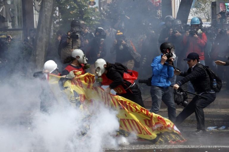 Turkish protestors clash with riot police as police use water cannon and tear gas to disperse protestors during a May Day rally in Istanbul, Turkey, 01 May 2015. Police used tear gas and water cannon against May Day protesters who sought to march toward Istanbul's iconic Taksim Square, where the government had banned demonstrations.