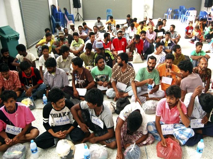 Suspected ethnic Rohingya migrants from Myanmar and Bangladesh rest as they were detained at the district hall in Rattaphum district, Songkhla province southern Thailand, 09 May 2015. Police discovered a mass grave in the southern province of Songkhla containing 26 bodies at an abandoned camp used by human traffickers. The remains were of Rohingya refugees from Myanmar, police said. Survivors from the camp told reporters and officials that they were regularly beaten by traffickers and some of them were left to die by the traffickers because they were too weak to be moved. The migrants believed from Myanmar or Bangladesh were also denied access to food and medicine unless they paid a ransom to their captors for their release. Police suspect the traffickers at the camp moved more than 300 Rohingyas across the border to Malaysia as authorities closed in.