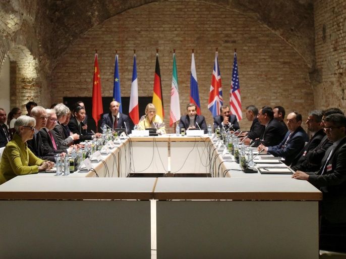 Negotiators of Iran and six world powers face each other at a table in the historic basement of Palais Coburg hotel in Vienna April 24, 2015. Nuclear talks are making good but slow progress as they work towards a June 30 deadline for a final deal, Tehran's senior negotiator Abbas Araqchi said on Friday. REUTERS/Heinz-Peter Bader