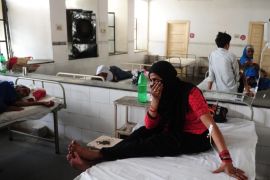Indian diarrhoea patient Nansi Bano gestures as she sit on a bed in a government hospital in Allahabad on May 28, 2015, as scorching weather conditions continue across India. Hospitals in India were struggling to cope with an influx of victims of a blistering heatwave that has claimed nearly 1,500 lives in just over a week. AFP PHOTO/SANJAY KANOJIA