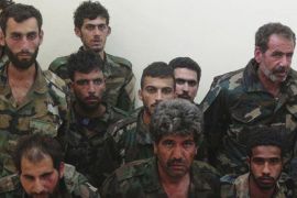 This picture released on Sunday, May 24, 2015, by a militant website which had been verified and is consistent with other AP reporting shows Syrian government soldiers who were captured by Islamic state militants in Palmyra area in Syria. The Syrian army is deploying troops in areas near the ancient town of Palmyra in apparent preparation for a counterattack to retake it from the Islamic State group, an official said. (Militant website via AP)