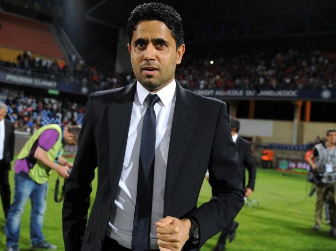 Paris Saint-Germain's Qatari president Nasser Al-Khelaifi enters the pitch after winning the French L1 football match between Montpellier (MHSC) and Paris Saint-Germain (PSG) on May 16, 2015 at La Mosson Stadium in Montpellier, southern France. Paris Saint-Germain won their third consecutive French Championship title by winning the match. AFP PHOTO / SYLVAIN THOMAS