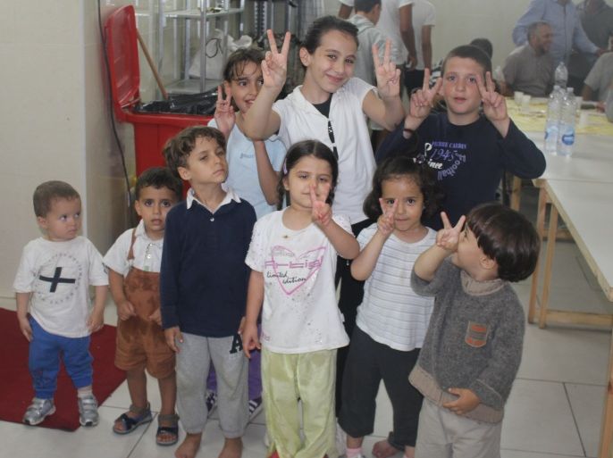 مجموعة من الأطفال السوريين وفدوا مع أهاليهم اللاجئين للمركز الإسلامي بمدينة كاتانيا الإيطالية. الجزيرة نت
