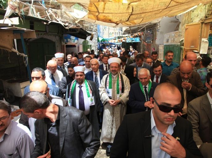 HEBRON, WEST BANK - MAY 16: The President of the Presidency of Religious Affairs of Turkey, Prof. Dr. Mehmet Gormez (C), visits the old streets of the Hebron city in West Bank on May 16, 2015.