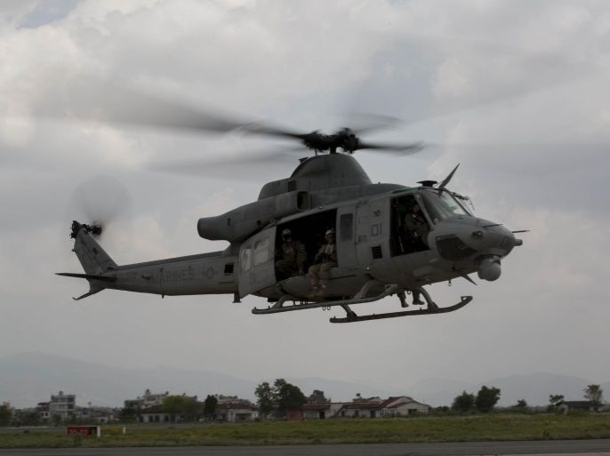A UH-1Y Huey helicopter flies into the Tribhuvan International Airport after a search and rescue operation in Kathmandu, Nepal, May 13, 2015. A UH-1Y Huey assigned to Marine Light Attack Helicopter Squadron 469, carrying six Marines and two Nepalese soldiers, went missing while conducting humanitarian assistance after a 7.3 magnitude earthquake on May 12. The Nepali army has been told a missing U.S. Marines helicopter with eight on board may have come down in a river in the Charikot area hit hard by an earthquake and 400 soldiers are engaged in the hunt, a senior officer said on Wednesday. REUTERS/Thor J. Larson/U.S. Marine Corps/Handout FOR EDITORIAL USE ONLY. NOT FOR SALE FOR MARKETING OR ADVERTISING CAMPAIGNS. THIS IMAGE HAS BEEN SUPPLIED BY A THIRD PARTY. IT IS DISTRIBUTED, EXACTLY AS RECEIVED BY REUTERS, AS A SERVICE TO CLIENTS