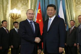 Russian President Vladimir Putin (C-L) and Chinese President Xi Jinping (C-R) shake hands during a meeting at the Kremlin in Moscow, Russia, 08 May 2015. Chinese President Xi Jinping is on official visit in Russia and will attend festive events marking the 70th anniversary of the victory of the Soviet Union and it's Allies over Nazi Germany in WWII.
