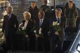 A handout picture provided French Army Communications Audiovisual office (ECPAD) shows (L-R) Spanish Defense Minister Pedro Morenes, German Defense Minister Ursula von der Leyen, French Defense Minister Jean-Yves Le Drian, and Polish Defense Minister Tomasz Siemoniak throw flowers from a French military boat under a submarine bunker to commemorate the 70th anniversary of the defeat of the Lorient German resistance pocket, in Lorient, France, 10 May 2015. In WWII, the city of Lorient was occupied by Nazi German troops, who resisted Allied Forces by taking shelter in the heavily protective submarine bunker. EPA/ARNAUD KARAGHEZIAN/ECPAD/HANDOUT