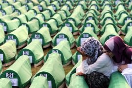(FILE) A file picture dated 11 July 2010 shows Bosnian Muslim women mourning over a casket during the funeral of 775 newly-identified Bosnian Muslims at the Potocari Memorial Center, Srebrenica, Bosnia and Herzegovina. The burial was part of a memorial ceremony to mark the 15th anniversary of the Srebrenica Massacre. July 2015 marks the 20-year anniversary of the Srebrenica Massacre that saw more than 8,000 Bosniak men and boys killed by Bosnian Serb forces during the Bosnian war. EPA/FEHIM DEMIR PLEASE REFER TO THIS ADVISORY NOTICE (epa04766937) FOR FULL PACKAGE TEXT *** Local Caption *** 02404574