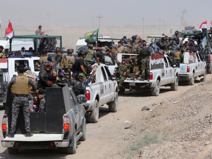 القوات العراقية المدعومة بمسلحين تسعى لاستعادة الرمادي (الفرنسية/غيتي)