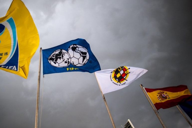 LAS ROZAS DE MADRID, SPAIN - MAY 28: Flags of Spain, Spain Football Federation and FIFA are seen at Ciudad del Futbol on May 28, 2014 in Las Rozas de Madrid, Spain.