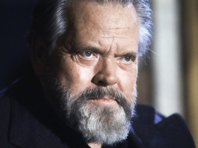 FILE - In this February 22, 1982 file photo, actor and film director Orson Welles poses for photographers during a press conference in Paris. A “very raw draft” of an unpublished Orson Welles memoir has joined the University of Michigan archives on the trailblazing filmmaker, the school says. (AP Photo/Jacques Langevin, File)