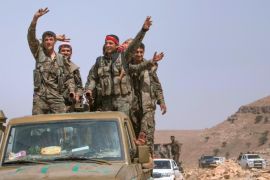 Kurdish People's Protection Units (YPG) fighters gesture while riding on their vehicle on Abd al-Aziz mountain, Hasaka province, after they said they took control of the area May 20, 2015. Kurdish People's Protection Units (YPG) took control of Abd al-Aziz mountain from Islamic state fighters, after clashes that lasted for several days, activists said. Picture taken May 20, 2015. REUTERS/Rodi Said