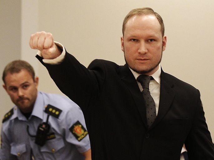 FILE - In this Aug. 24, 2012 file photo, mass murderer Anders Behring Breivik, makes a salute after arriving in the court room at a courthouse in Oslo. Breivik, who admitted killing 77 people in Norway last year, was declared sane and sentenced to prison for bomb and gun attacks. Convicted Norwegian mass-killer Breivik has threatened to go on hunger strike unless he gets access to better video games, a sofa and a larger gym. n a letter received by The Associated Press Tuesday Feb. 18, 2014, Breivik writes the hunger strike will continue until his demands are met or he dies. (AP Photo/Frank Augstein, File)