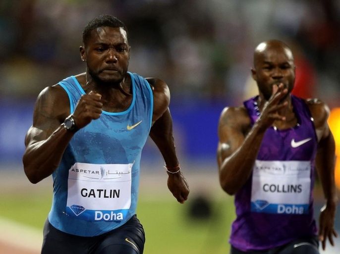 Justin Gatlin (L) of the United States sprints to win the 100m men's race at the Diamond League athletics meeting at the Suhaim bin Hamad Stadium in Doha on May 15, 2015. Gatlin set a world best time for 2015 at a Diamond meeting when he stormed to a 100m sprint victory in 9.74sec, making him the fifth fastest man ever. AFP PHOTO / MARWAN NAAMANI