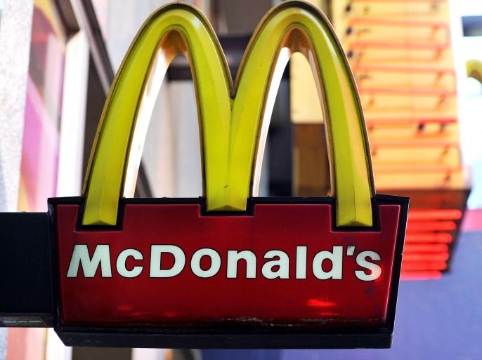 (FILE) A file picture dated 18 October 2013 shows a McDonald's fast food restaurant sign in New York City, New York, USA. Fast food giant McDonald's on 04 March 2015 said it would phase out serving chicken raised with antibiotics used to treat humans, in an apparent effort to regain customers who have fled to rivals seeking healthier food. 'Our customers want food that they feel great about eating - all the way from the farm to the restaurant - and these moves take a step toward better delivering on those expectations, ' said McDonald's US president Mike Andres. The guidelines apply to its 14,000 US restaurants, with the goal of full implementation within two years.