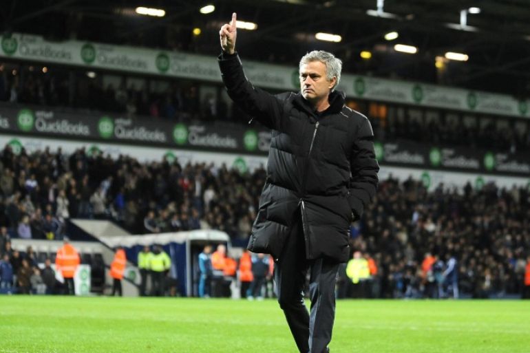 Chelsea manager Jose Mourinho gestures to supporters, after the English Premier League soccer match between West Bromwich Albion and Chelsea at the Hawthorns, West Bromwich, England, Monday, May 18, 2015. (AP Photo/Rui Vieira)
