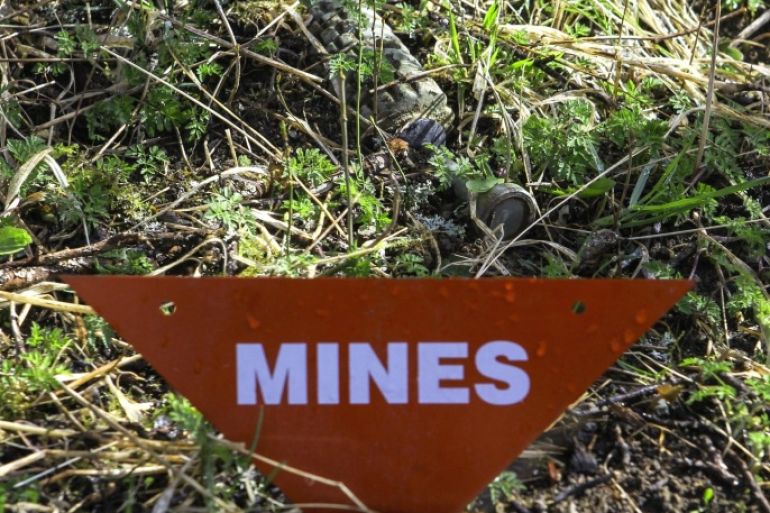 SARAJEVO, BOSNIA AND HERZEGOVINA - APRIL 5 : A landmine is seen as members of Bosnia and Herzegovina Mine Action Centre (BHMAC) clear landmines at a minefield, in Sarajevo, Bosnia and Herzegovina on April 5, 2015. On UNs International Day of Mine Awareness, Bosnia and Herzegovina estimates that 1,176 square kilometers of its territory remains infested with around 120,000 mines.
