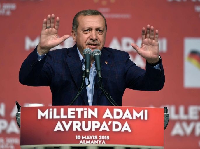 Turkish President Recep Tayyip Erdogan delivers a speech in an exhibition hall in Karlsruhe, Germany, Sunday, May 10, 2015. Erdogan has urged compatriots during his appearance to preserve their homeland’s values and language and to vote ahead of upcoming Turkish elections. (Ulli Deck/dpa via AP)