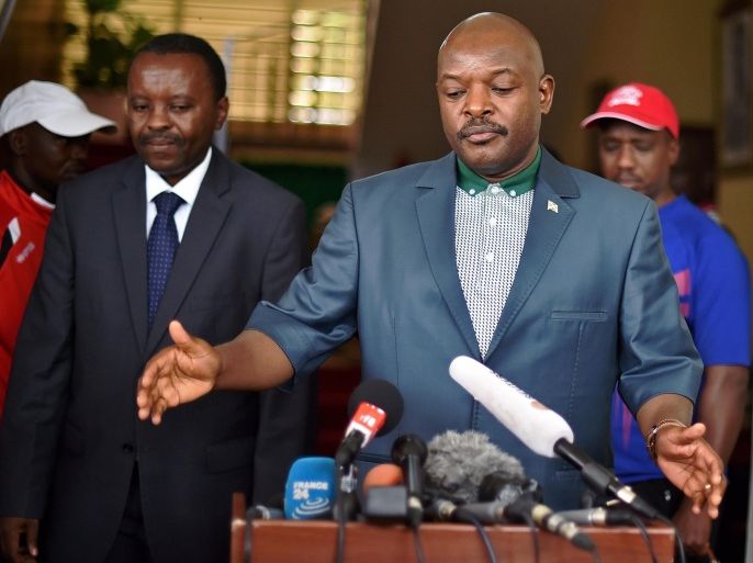 Burundi's President Pierre Nkurunziza talks to the media at the President's office in Bujumbura on May 17, 2015 as he made his first official appearance since an attempted coup against him this week. Nkurunziza has been facing weeks of violent and deadly street protests over his controversial bid to stand for a third consecutive term on office, and on Wednesday top generals announced they were overthrowing him while he was on a visit to neighbouring Tanzania. AFP PHOTO / CARL DE SOUZA