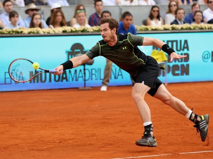 MADRID, SPAIN - MAY 10: Andy Murray of Great Britain plays a forehand against Rafael Nadal of Spain in the mens final during day nine of the Mutua Madrid Open tennis tournament at the Caja Magica on May 10, 2015 in Madrid, Spain.