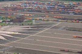 Aerial view taken on May 9, 2015 shows freight trains standing on railtracks at the Maschen marshalling yard in Seevetal, northwestern Germany. German train drivers on May 10, 2015 ended a week-long walkout, the longest in the history of rail operator Deutsche Bahn, with a promise to give strike-weary passengers 'a break' for a while. AFP PHOTO / DPA / CHRISTIAN CHARISIUS +++ GERMANY OUT
