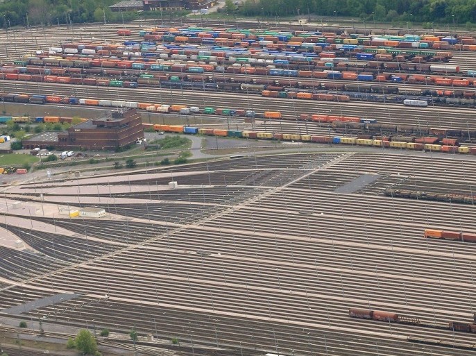 Aerial view taken on May 9, 2015 shows freight trains standing on railtracks at the Maschen marshalling yard in Seevetal, northwestern Germany. German train drivers on May 10, 2015 ended a week-long walkout, the longest in the history of rail operator Deutsche Bahn, with a promise to give strike-weary passengers 'a break' for a while. AFP PHOTO / DPA / CHRISTIAN CHARISIUS +++ GERMANY OUT