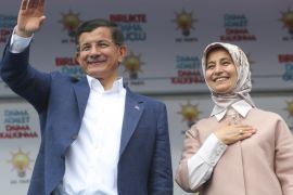 ANKARA, TURKEY - MAY 30: Turkey's Prime Minister and leader of the ruling Justice and Development Party, Ahmet Davutoglu (L) and his wife Sare Davutoglu (R) greet the supporters during an election rally in Ankara, Turkey on May 29, 2015.