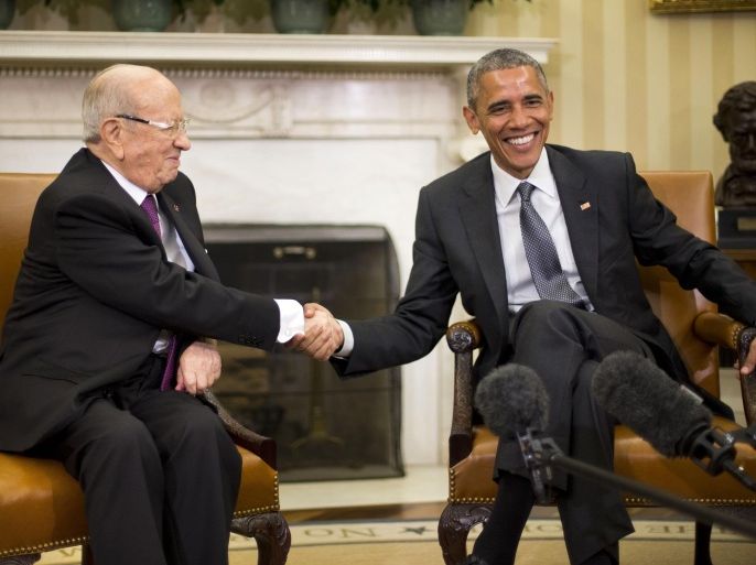 President Barack Obama shakes hands with Tunisian President Beji Caid Essebsi during their meeting in the Oval Office of the White House in Washington, Thursday, May 21, 2015. (AP Photo/Pablo Martinez Monsivais)