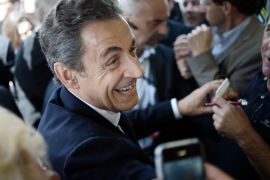 Former French President Nicolas Sarkozy, leader of France's main opposition right-wing party, formerly known as the 'UMP' arrives to the party congress to mark the foundation of the movement 'Les Republicains' (The Republicans) in Paris on May 30, 2015, as his scandal-tainted party seeks to improve its image ahead of the 2017 presidential race. Members of the right-wing party voted 83 percent in favor of the party's name change, according to results released by the leadership. AFP PHOTO / STEPHANE DE SAKUTIN