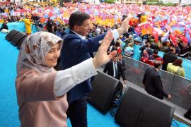 ANKARA, TURKEY - MAY 30: Turkey's Prime Minister and leader of the ruling Justice and Development Party, Ahmet Davutoglu (R) and his wife Sare Davutoglu (L) greet the supporters during an election rally in Ankara, Turkey on May 29, 2015.