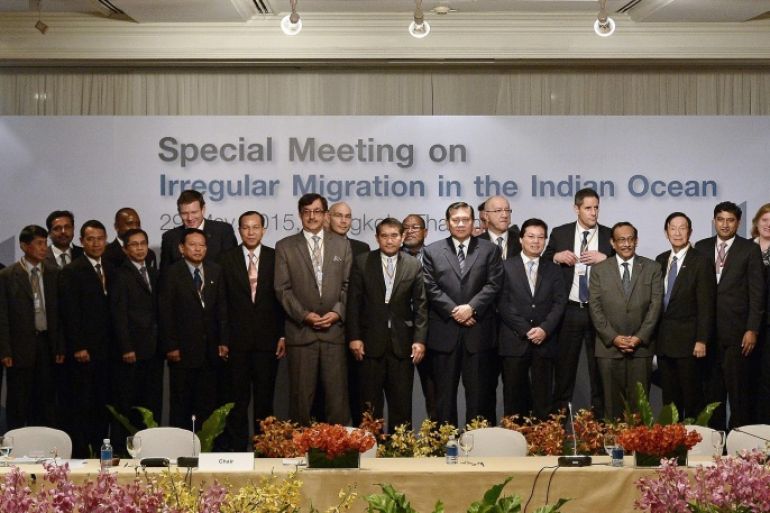 Thai Foreign Minister and deputy Prime Minister Tanasak Patimapragorn (C) poses for a group picture along with delegates from 17 nations and observers during an international meeting on migration in the Indian Ocean in Bangkok on May 29, 2015. Myanmar rebuked the UN on May 29 for calling on the country to address the root causes of the exodus of Rohingya Muslims from its shores, saying it is being 'singled out' for criticism as an international meeting exposed tensions over Southeast Asia's migrant crisis. AFP PHOTO / Christophe ARCHAMBAULT