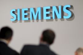 The Siemens logo is seen during the IFA Electronics show in Berlin in this September 4, 2014 file picture. German industrial group Siemens posted a slightly larger-than-expected 5 percent drop in quarterly industrial profit as a weak result at its digital factory unit compounded problems at its energy operations. Siemens said on May 7, 2015 it would cut an additional 4,500 jobs, or roughly 1 percent of the global workforce, as it struggles with low demand and price erosion in its core gas turbines business while grappling with a host of other underperforming operations. REUTERS/Hannibal Hanschke/Files