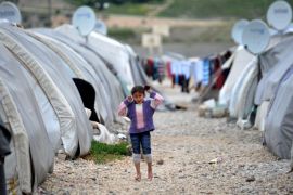 GAZIANTEP, TURKEY - APRIL 15: A Syrian kid fled from the civil war, living in a refugee camp is seen in Nizlip district of Gaziantep, Turkey on April 15, 2015.