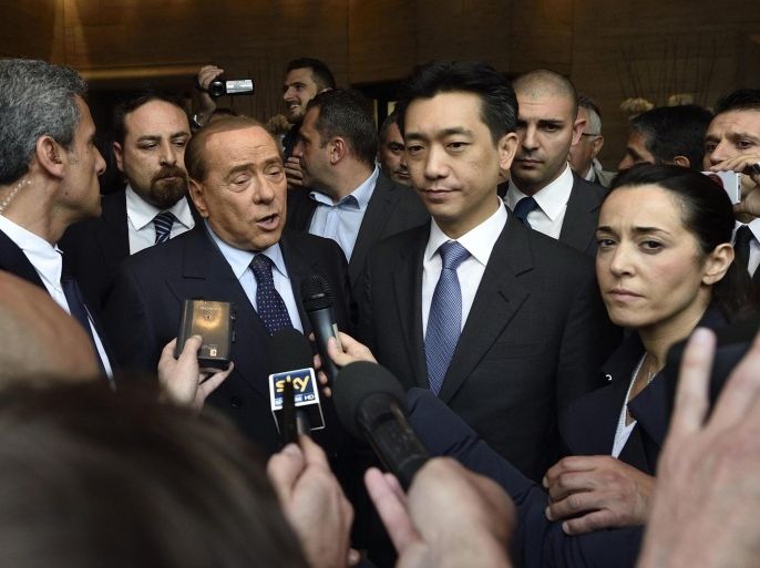AC Milan President Silvio Berlusconi (C-L) and Thai businessman Bee Taechaubol (C-R) speak to members of the media at the end of their meeting in Milan, Italy, 02 May 2015.
