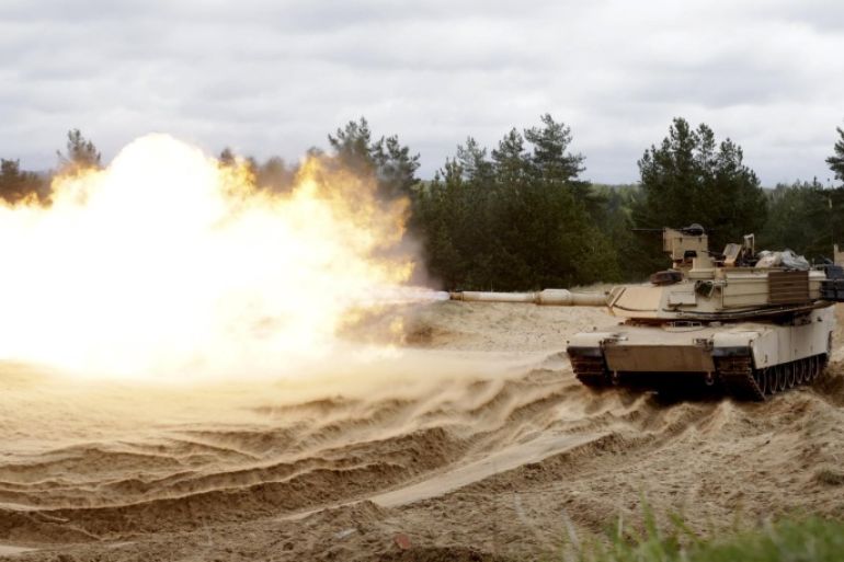U.S. soldiers of the 2nd Battalion, 7th Infantry Regiment, "Cottonbalers”, who are deployed in Latvia, take part in a training exercise with M1A2 "Abrams" tank in Adazi military base, Latvia, May 7, 2015. REUTERS/Ints Kalnins